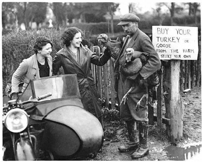 December 1936. Two women shop for a turkey at a farm just outside Tewkesbury. Happy Christmas!