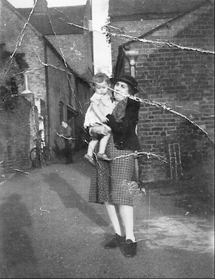 The author  in Red Lane<br>in the arms of her grandmother