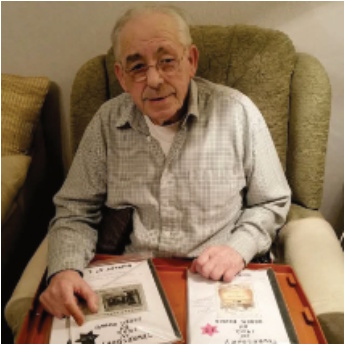 Derek with the articles hand-written with his wife, Cath